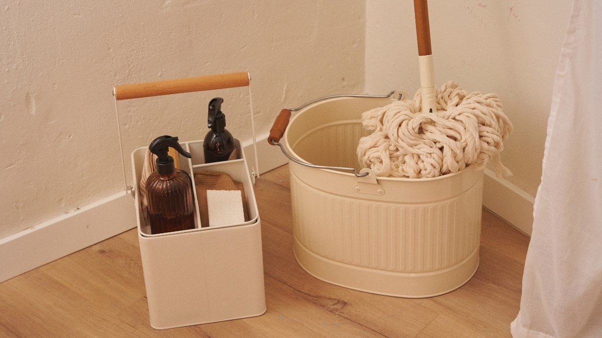 cream-colored metal cleaning caddy